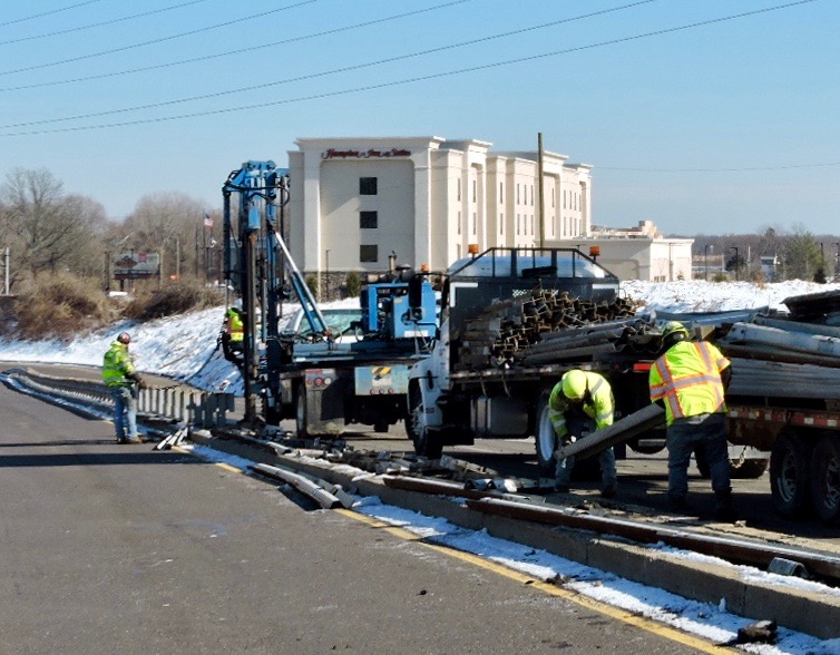 Crews removing the guiderail on U.S. 1